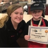 Dressed as an Arby's employee, girl wins first in Halloween costume contest.