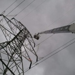 Grounding transmission line out of man basket.