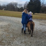 Me training a little girl how to ride