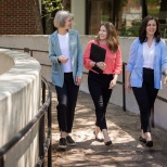 Good Shepherd team members walk and talk in the Healing Gardens.