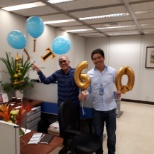 I am wearing blue long-sleeve shirt and our Office is celebrating the 60th birthday of our colleague