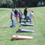 Employees participate in a cornhole tournament during the 2019 employee appreciation event