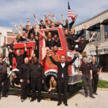 Team photo at Rebuilding Together playhouse reveal