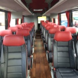 Black leather seating and hardwood floors on our Temsa motor coaches!