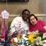 Atria Rosyln Harbor staff member joins a resident for her birthday celebration.