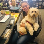 Our Catering Sales Coordinator in our SF office with our Office Dog.