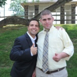 Luke and his teacher, Art, give a thumbs-up after graduation services