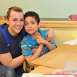 Noah and his teacher, Claire, in the classroom