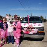 Chuck E and local employees supporting participants in the Susan G Komen Walk