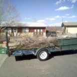 Rig loaded with twigs and limbs.