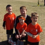 Coach Jamie and kiddos from spring soccer season