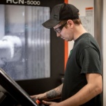 One of our machinists operating the new Mazak Smooth CNC control.