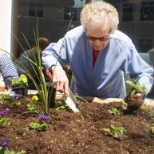 Enjoying recreational activities with residents outside.