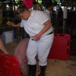 Grooming a pig at the County fair before one of my fellow members went into the show ring.