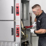 Technician working on a steamer