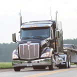 TMC Driver, hauling a load of roofing