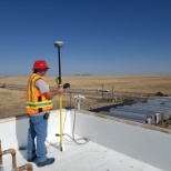 Surveying on the roof of a Mattress Factory