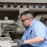 Our Technician working on a Waukesha Engine