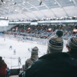 Employees enjoy a night out at a Syracuse Crunch game with their friends and families.