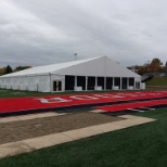 Beautiful structure tent on a football field for a school.