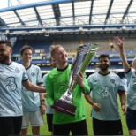 Three employees playing at Stamford Bridge