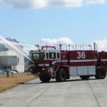 Maintenance department mechanic performing functional test on new crash truck.