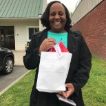 Antoinette gets surprised with an RBT bottle for passing her RBT exam as she finishes her session.