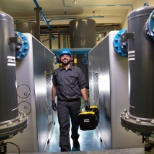 Atlas Copco Compressors employee walking through a job site,