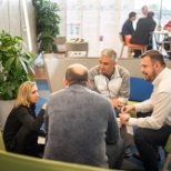 Woman and men working at our headquarter