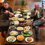 Bravo TVs Top Chef Katsuji Tanabe and GM Phil Madey belly up to a menu's worth of food. 