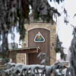 An artistic marketing shot showing the resort logo on the iconic Seven Springs Tower.