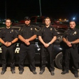 Officers stand by Patrol vehicle