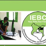 IEBC employee attending to a voter.