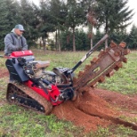 Dennis' 7 Dees crew member on trencher machinery