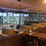 TapHouse featuring eight lanes with billiard style bowling balls and lounge style atmosphere