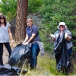 A group of volunteers help to clean up the Deschutes river banks