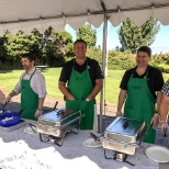 Annual Summer Barbecue - Employees are served food by the Directors and get to mingle with coworkers