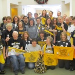 Staff and residents cheering for their favorite team.