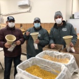 Painters volunteering to pack food for Kids Against Hunger