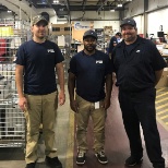 Some of the ECI Panel Shop team took a moment to show off their hats and shirts with the new ECI log