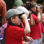 Children learn binocular basics before heading to the Lookout ... a true 