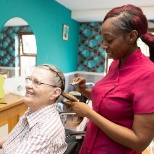 One of our Lifestyle Coordinators supporting a resident with her regular visit to the hairdressers.