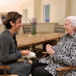 One of our Caregivers enjoying time with a resident.