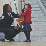 Security officer helping a child