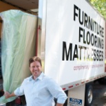 Our Director of Logistics helping unload a truck for a mattress donation.