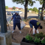 Staff members helping during campus cleanup day.