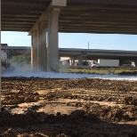 Pouring lime for future road.