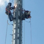 myself and a crewman doing modifications on a mono-pole