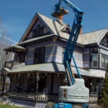 Crew working to remove a tree from the chimney and to re-point. May 2016