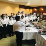 Our wonderful dining team huddles up for another successful day.